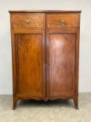 A Regency mahogany press cupboard wardrobe with ebony and satinwood strung inlay with panel doors