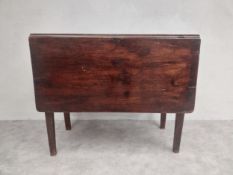 An 18th century mahogany drop leaf dining table with gate-leg square section supports. H.74.5 W.90