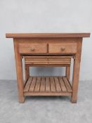 A Victorian style teak and pine butchers block type kitchen table. H.91 W.89 D.59.5cm