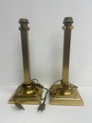 A pair of 1970's vintage brass table lamps with fluted square section brass columns on stepped