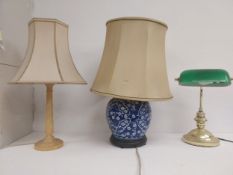 A banker's desk lamp with green glass shade along with two table lamps with shades. H.58cm (