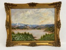 A large oil on canvas, Continental school lakescape with a town by the shore, signed and dated