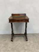A 19th century walnut Davenport writing desk with fitted pen section above inset leather writing