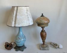 A 19th century French ceramic vase table lamp with duck egg glaze and gilt decoration raised on a