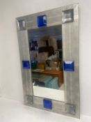 A mid-century Italian wall mirror in hand-hammered Venetian glass. H.110 W.70cm.