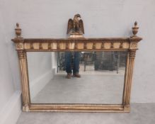A Regency giltwood, painted and gesso overmantel mirror with carved eagle cresting above original