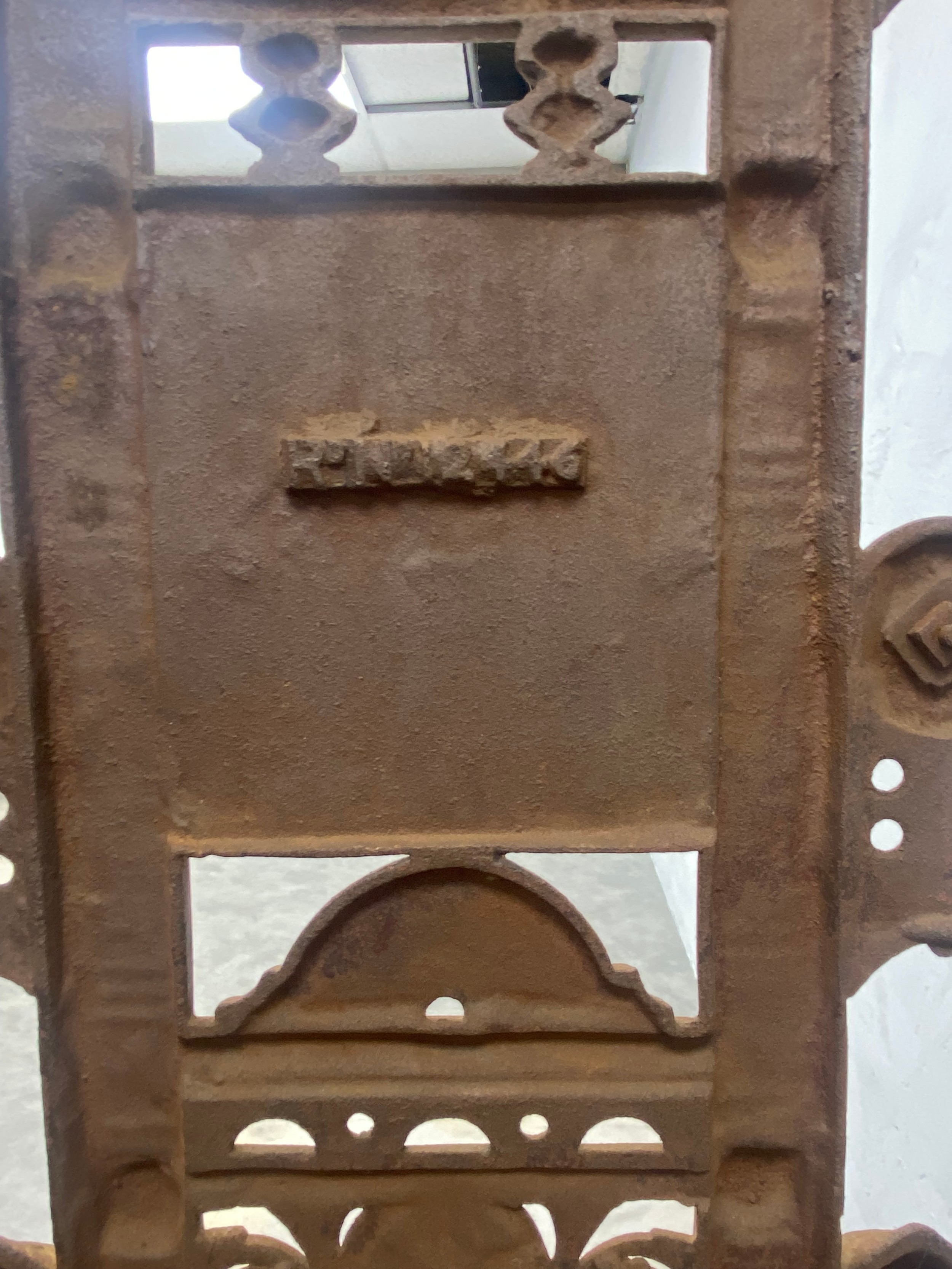 A Victorian cast iron hallstand fitted with mirror and marble shelf with foundry mark to the back. - Image 5 of 5