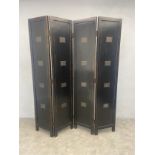 A painted and lacquered four panel screen or room divider each panel inlaid with Chinese writing on