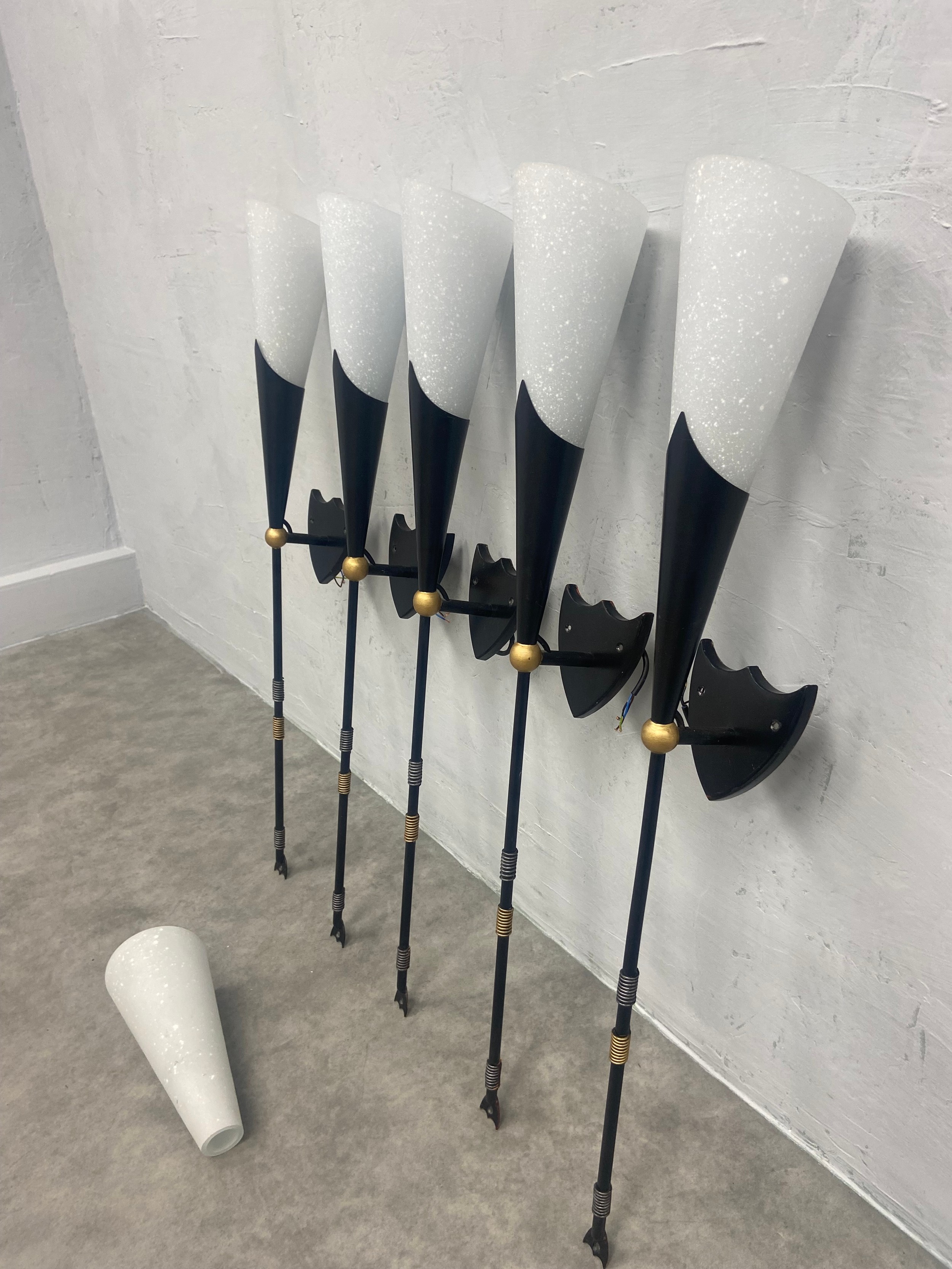 A set of five metal wall lights in the form of heraldic torches with 6 white glass Christopher Wray - Image 3 of 5