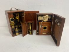 An early 20th century Swift & Son microscope in fitted box, a 19th century boxed drum microscope and