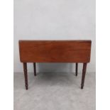 A 19th century mahogany drop flap Pembroke table with frieze drawer on turned tapering legs. H.66.