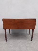 A 19th century mahogany drop flap Pembroke table with frieze drawer on turned tapering legs. H.66.