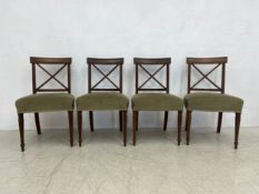A set of four early 19th century mahogany bar back dining chairs with stuffover seats on turned