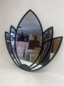 A 1970's vintage Italian lacquered wall mirror of water lilly form. H.101. W.105cm.