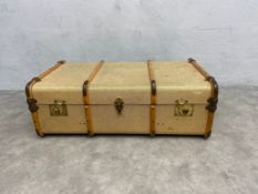 A vintage canvas and beech and metal bound travelling trunk. L.93 D.56cm