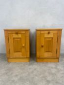A pair of cotemporary maple bedside cabinets fitted with slides above panel doors. H.60 W.41 D.41cm.