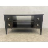 A contemporary John Lewis black lacquered small sideboard or TV or HI-FI cabinet with retailer's