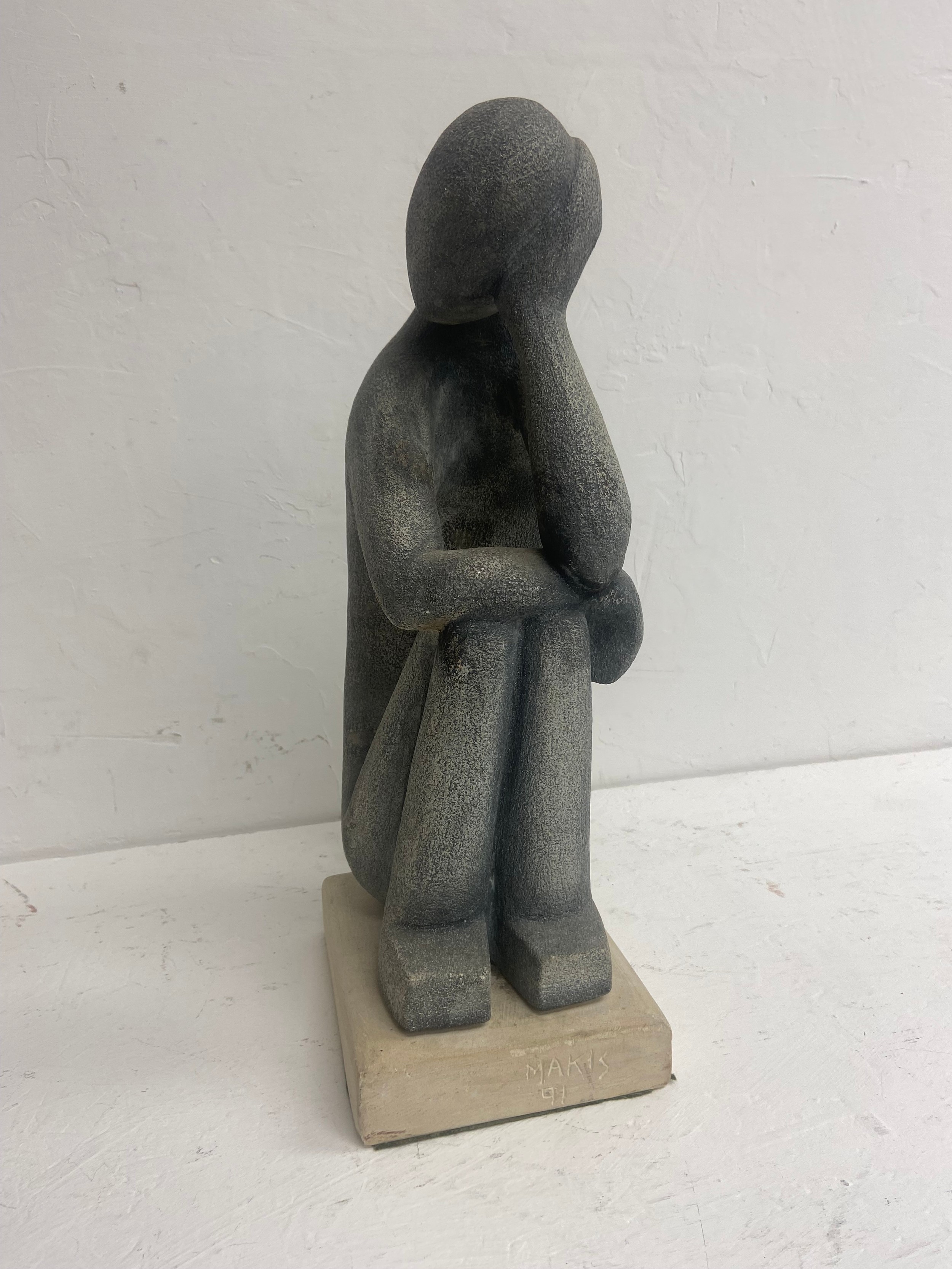 A carved stone seated figure in the modernist style signed and dated Makis to the base. H. - Image 3 of 4
