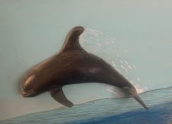 A mixed media study in 3-D; a dolphin leaping from the sea, signed, dated and titled to the reverse.