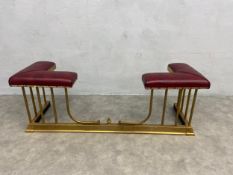 A 19th century style club fender with upholstered pad seat on brass base with adjustable