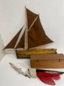 A vintage gaff rigged wooden pond yacht and a boxed Tri-Ang similar. L.88cm