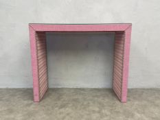 A contemporary console table in studded velour with plate glass top. H.92. W.110 D.35cm.