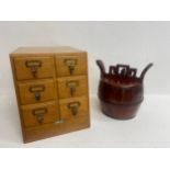 A mid century oak table top stationery cabinet and a Chinese lacquered rice bucket with secret