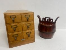 A mid century oak table top stationery cabinet and a Chinese lacquered rice bucket with secret