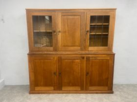 A Derek "Lizardman" Slater of Crayke oak two section library bookcase with signature lizard carved