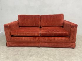 A Colefax and Fowler Mousson style upholstered sofa in Sibton fabric. L.200 D.105cm