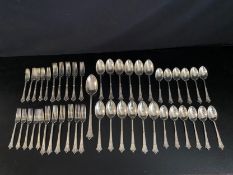 Forty six pieces of silver Albany pattern flatware: Twelve table spoons, twelve dessert spoons,