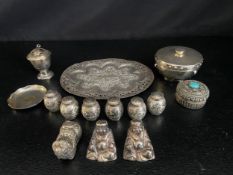 A collection of silver items to include South East Asian salt and pepper pots, tray, etc. 540g.