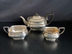 A three piece silver tea set; teapot, sugar bowl and milk jug, Roberts & Belk, Sheffield 1931.