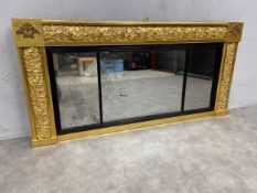 A Regency gilt framed overmantel mirror with original triple section plate. 120x58cm.