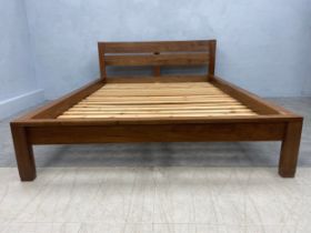 A contemporary hardwood bedstead to take a standard double 4'6" mattress.