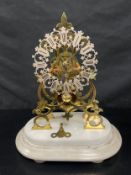 A late 19th century brass skeleton clock with chain driven fusee movement on stepped marble base.