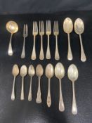Four silver table forks, two table spoons, two dessert spoons and a dessert fork, hallmarked