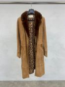 A Dolce and Gabbana ladies coat, suede with fur collar. Medium sized.