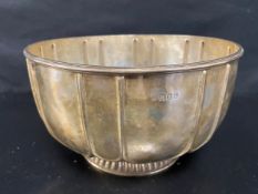 A large silver bowl on a circular gadrooned foot, Britannia standard marks, London 1904. Dia.