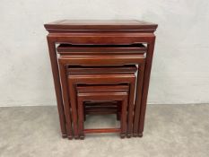 A nest of four Chinese lacquered hardwood graduating occasional tables. H.66 W.51 D.36cm.