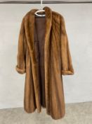 A full length ladies mink coat, Saga Mink label, size 10/12. In very good condition.