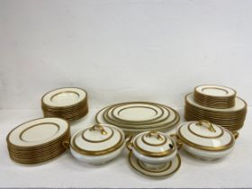 A Royal Doulton dinner service to include twelve dinner plates, bowls graduating serving plates,
