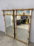 A pair of early 19th century painted pier mirrors with ball decorated pediments and reverse glass