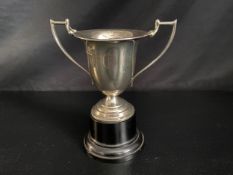 An engraved silver trophy cup, Sheffield 1930. H.22cm. Weight 342g (Not including stand but with