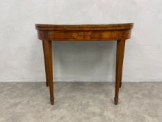 A 19th century flame mahogany card table with rosewood and satinwood crossbanding the fold-over