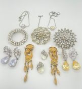 Mixed costume jewellery including three brooches (some stones missing, one brooch with newly