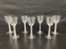 A set of seven Lalique Phalsbourg glasses from a 1924 design with incised marks to the bases. H.