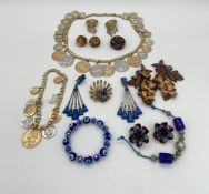A collection of costume jewellery to include five pairs of clip-on earrings (one pair by Astolfo),