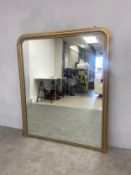 A large 19th century style gilt overmantel mirror with arched beaded plate. 145x122cm.