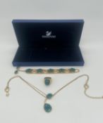 Swarovski suite of two blue and green crystal necklaces and a ring, longest 37cm.